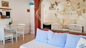 A bedroom with a bed, a desk, and a chair. - Apartment Valic (novi) - near the Center, 250m from the Beach (Baska)