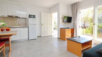 Fridge, microwave, stovetop, coffee/tea maker