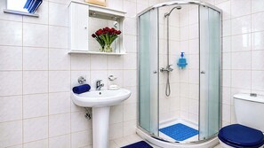 Shower, hair dryer, towels, shampoo