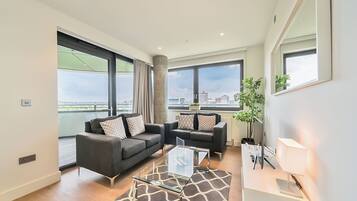 Apartment, 2 Bedrooms | Living area | 40-inch Smart TV with digital channels, MP3 dock, streaming services