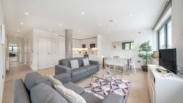 Apartment, 3 Bedrooms | Living area | 40-inch Smart TV with digital channels, MP3 dock, streaming services