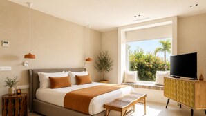 A modern bedroom with a bed, bedside tables, a TV, and a window with a view.
