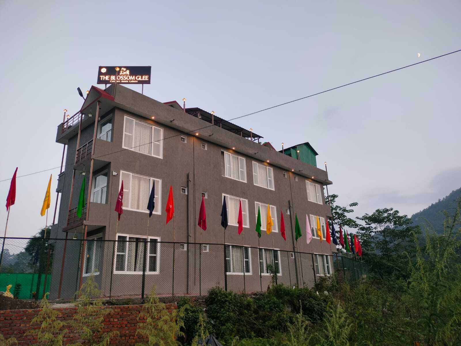 A multi-story building with a sign reading "The Blossom Clee."