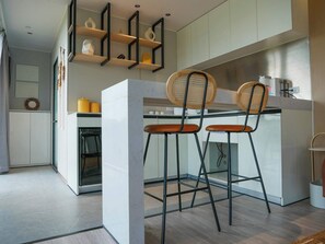 Fridge, microwave, stovetop, coffee/tea maker