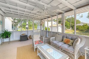 A covered porch with wicker furniture, including a sofa and chairs, a table, and a ceiling fan. - 2 Blocks to Crystal Coast: Family-friendly Retreat (Harkers Island)