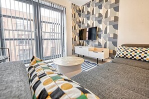 Apartamento, 2 quartos | Área de estar