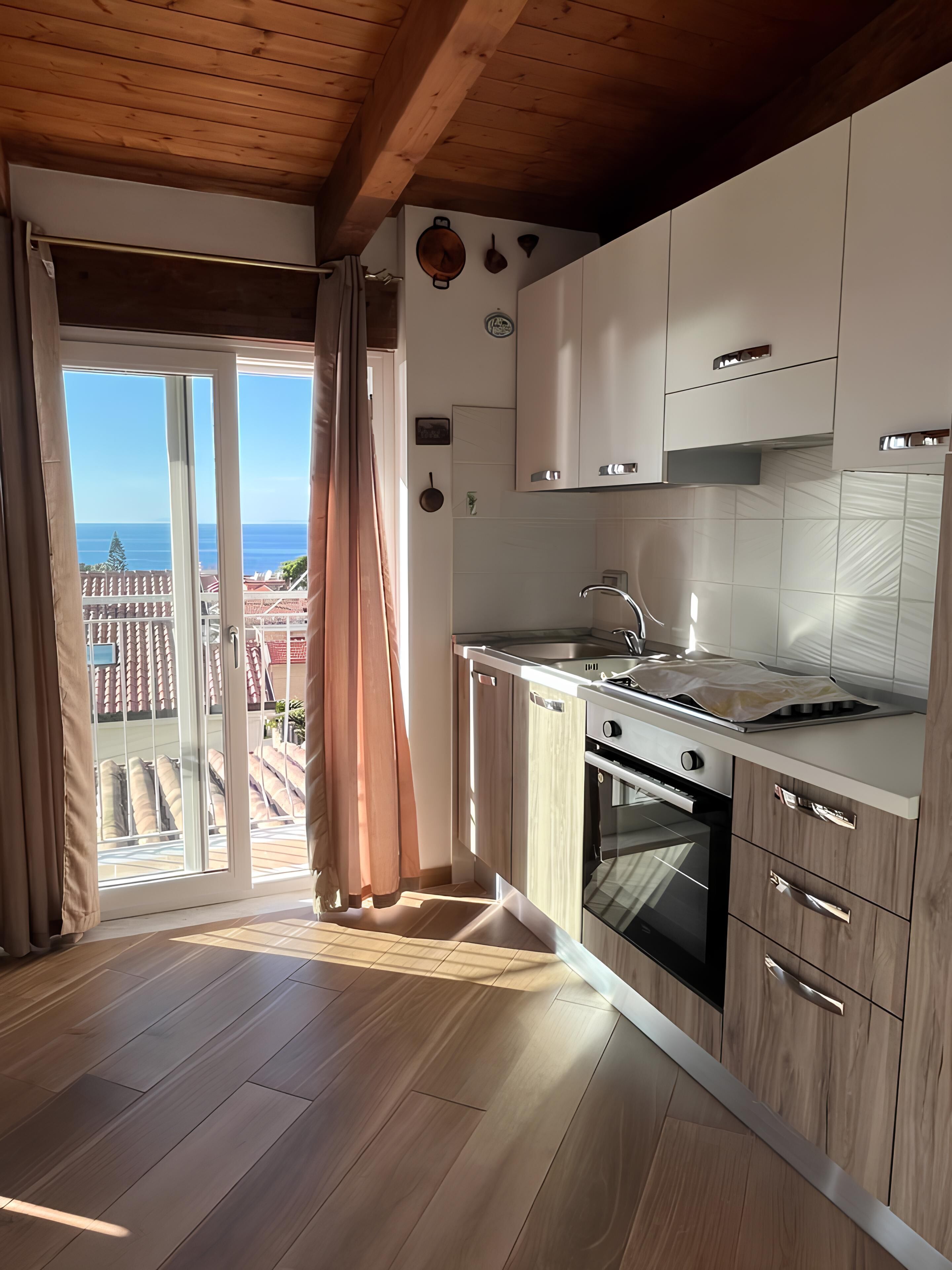 Een koelkast, een oven, een kookplaat, een koffiezetapparaat/waterkoker