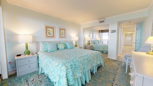 A bedroom with a bed, nightstands, and a dresser. There are two framed pictures on the wall. - Pelican Watch 301-Beautiful Third Level Oceanfront 3 Bedroom 2 bath End Unit with elevator (Carolina Beach)