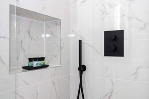 Shower, hair dryer, towels, soap