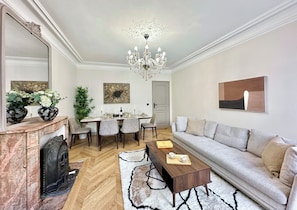 Apartment, City View | Living area | 80-cm flat-screen TV with digital channels - 1559 Rocroy (Paris)