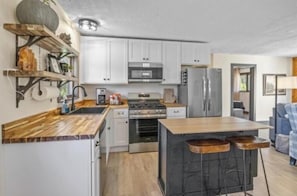 Microwave, oven, stovetop, dishwasher - Cozy Lodge on 10 acres- Sleeps 9, Newly Renovated, Game Room, Lg Deck, Irons MI. (Irons)