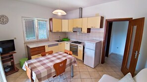 Apartment (One-Bedroom Apartment With Terrace (A) | Private kitchen | Fridge