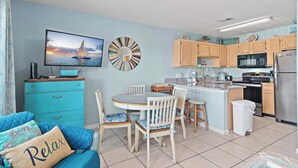 A compact kitchen with wooden cabinets, a microwave, and a refrigerator. - ⭐Gulf Views-Hot Tub-Private Balcony-1BR+Bunk Summerspell 303⭐ (Miramar Beach)