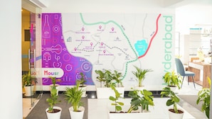 A hotel lobby with a map highlighting various locations and amenities. - Housr 78 Madhapur Hyderabad Hitech City (Hyderabad)