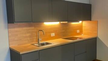 Apartment, Balcony | Private kitchen | Dining tables