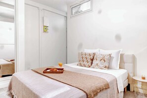 1 bedroom, desk, iron/ironing board, travel crib