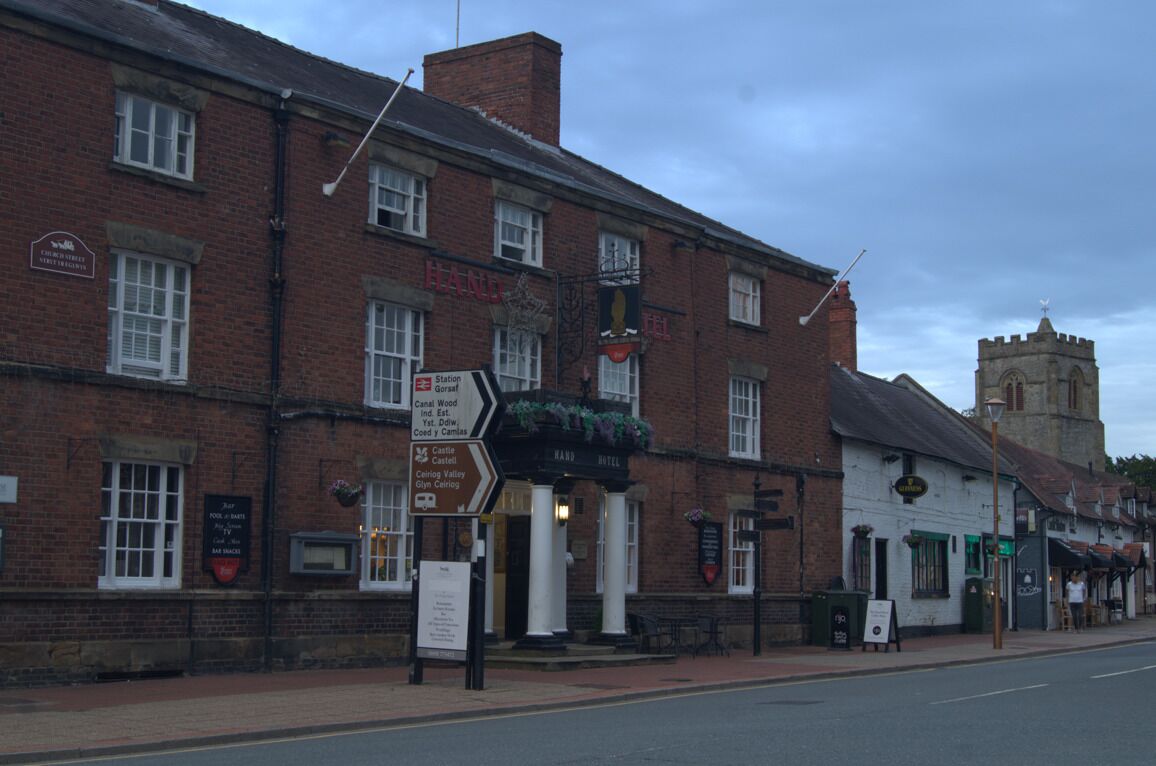 A traditional brick building with a sign for 'The Castle Hotel' and a directional sign for 'Castle Hotel, Castle Hotel, Castle Hotel, Castle Hotel, Castle Hotel, Castle Hotel, Castle Hotel, Castle Hotel, Castle Hotel, Castle Hotel, Castle Hotel, Castle Hotel, Castle Hotel, Castle Hotel, Castle Hotel, Castle Hotel, Castle Hotel, Castle Hotel, Castle Hotel, Castle Hotel, Castle Hotel, Castle Hotel, Castle Hotel, Castle Hotel, Castle Hotel, Castle Hotel, Castle Hotel, Castle Hotel, Castle Hotel, Castle Hotel, Castle Hotel, Castle Hotel, Castle Hotel, Castle Hotel, Castle Hotel, Castle Hotel, Castle Hotel, Castle Hotel, Castle Hotel, Castle Hotel, Castle Hotel, Castle Hotel, Castle Hotel, Castle Hotel, Castle Hotel, Castle Hotel, Castle Hotel, Castle Hotel, Castle Hotel, Castle Hotel, Castle Hotel, Castle Hotel, Castle Hotel, Castle Hotel, Castle Hotel, Castle Hotel, Castle Hotel, Castle Hotel, Castle Hotel, Castle