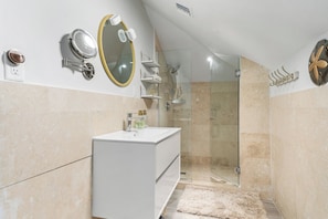 Shower, hair dryer, towels, soap