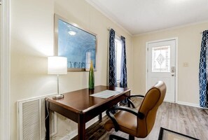 Enjoy a comfortable stay in this well-appointed room with a desk, chair, and large window.