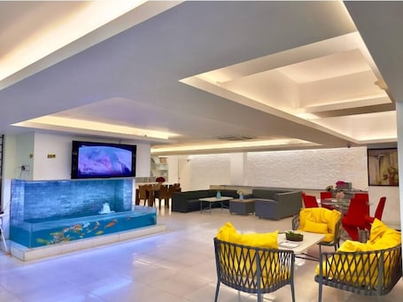 Living area. 350sqft 5 Apartment Pool Gym & Movie
