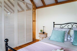 1 bedroom, desk, iron/ironing board, travel crib