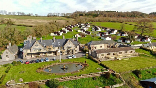 A large estate with a central courtyard, a swimming pool, and a solar panel array. - Harcombe House Rooms - First Floor Double (Newton Abbot)