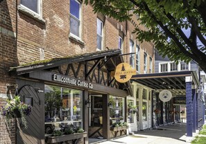 A storefront with a sign for 'Elicottville Coffee Co.' and 'Alpine Bistro.'