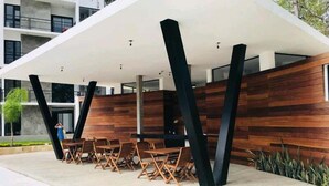 Outdoor dining - Modern Condo, Great Pool, Beach 5 mins (Puerto Vallarta)