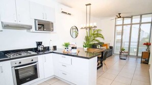 Coffee/tea maker, fridge, microwave, oven