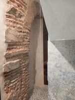 Deluxe Double Room, Patio, Courtyard View | Bathroom | Hair dryer, towels, soap, shampoo