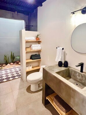 Shower, towels, soap, toilet paper
