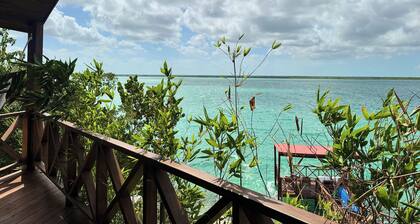 Suite with lagoon view, balcony and private pier