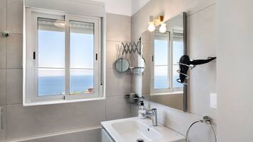 Shower, hair dryer, towels