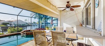 Canal front home with private pool, lanai, and washer and dryer.