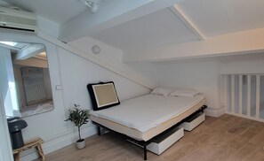 2 habitaciones y tabla de planchar con plancha 