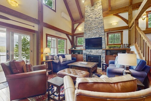 Spectacular lakefront home w/ private dock, beach, swim platform, gazebo & porch