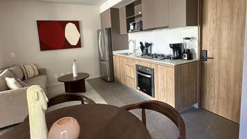 Coffee/tea maker, fridge, microwave, oven