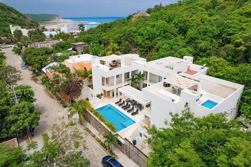 Rooftop Plunge Pool & Surf-Friendly Beach