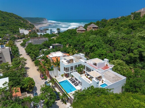 Rooftop Plunge Pool & Surf-Friendly Beach