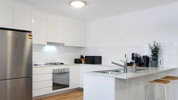 Coffee/tea maker, fridge, microwave, oven