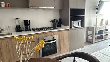 Coffee/tea maker, fridge, microwave, oven