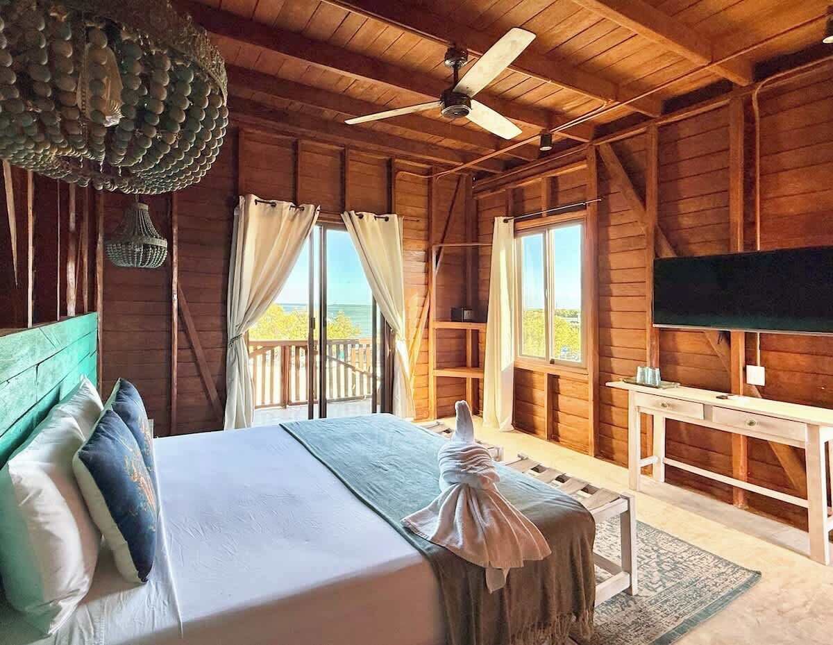 Bedroom with two beds and all-wood finishes