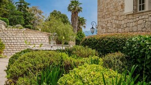A stone building with a window and a stone wall. - Bastide Blanche - Five Bedroom Villa, Sleeps 12 (Vence)