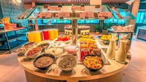 A buffet with various food items and beverages. - Coral Cotillo Reef (La Oliva)