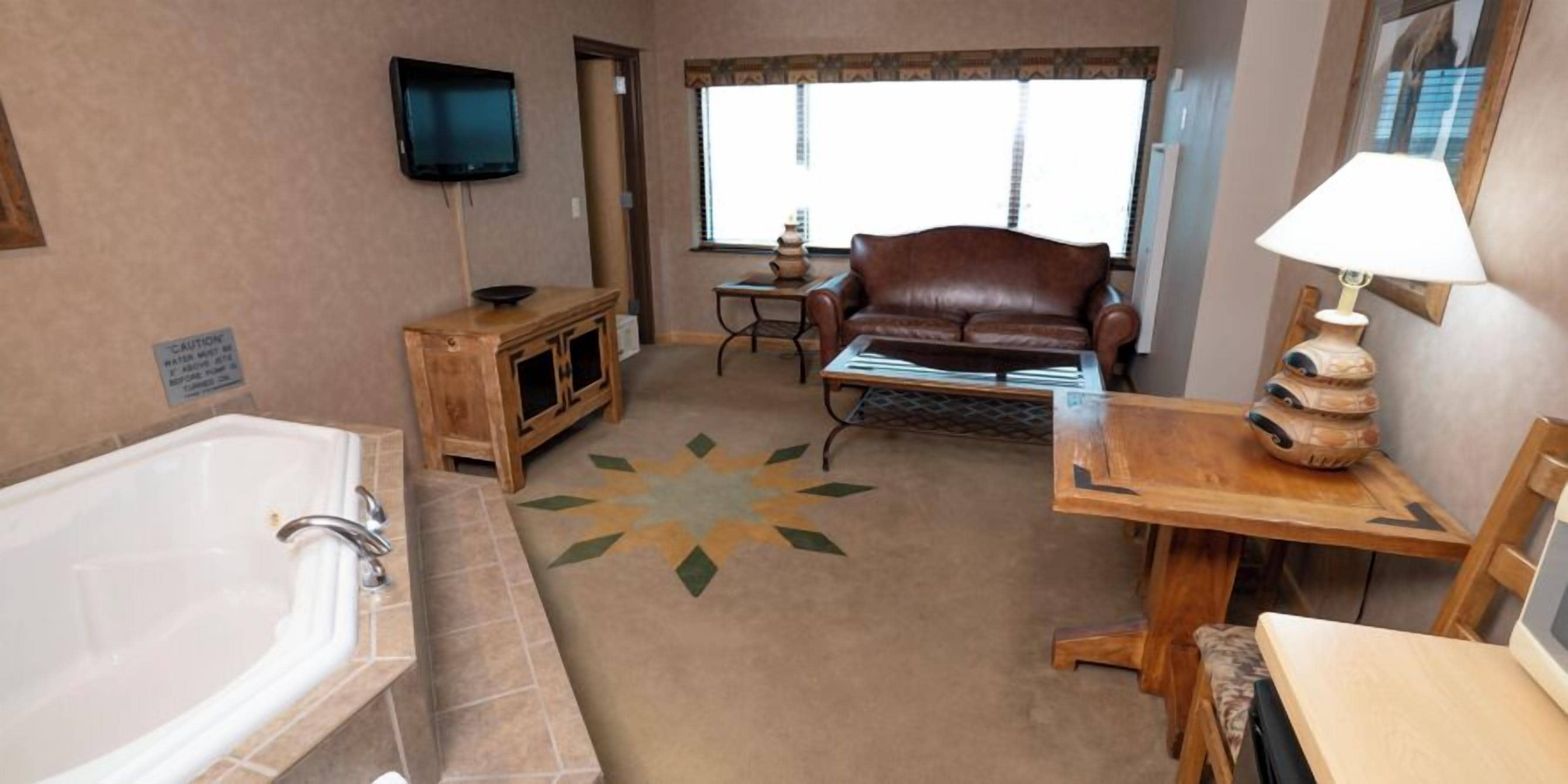 King Suite | Living area | 31-inch flat-screen TV with cable channels, pay movies