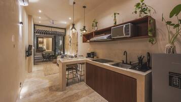 Fridge, microwave, stovetop, coffee/tea maker