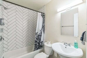 Shower, hair dryer, towels, shampoo