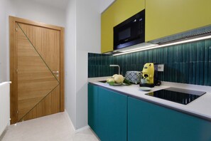 Fridge, microwave, stovetop, coffee/tea maker