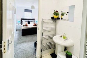 Shower, towels, soap, toilet paper