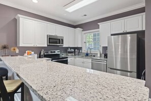 Fridge, oven, coffee/tea maker, dining tables